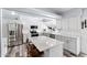 Beautiful kitchen boasts stainless steel appliances, island with seating, and sleek white subway tile backsplash at 633 Leisure World --, Mesa, AZ 85206