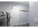 Well-lit laundry room with modern front-load washer and dryer, gray walls, and vinyl floors at 633 Leisure World --, Mesa, AZ 85206