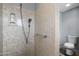 Shower with stone surround, brushed metal shower head and hardware, and access to the toilet at 633 Leisure World --, Mesa, AZ 85206
