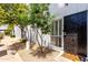 Charming front entrance features a secure black metal gate and a well maintained pebble ground cover at 6348 N 7Th Ave # 6, Phoenix, AZ 85013