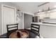 Eat-in kitchen with stainless appliances and white cabinetry, perfect for casual dining and entertaining at 6348 N 7Th Ave # 6, Phoenix, AZ 85013