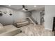 Inviting living room featuring wood floors, neutral walls, a cozy sofa, and staircase at 6348 N 7Th Ave # 6, Phoenix, AZ 85013