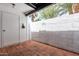 Private outdoor patio with brick flooring and lush landscaping at 6348 N 7Th Ave # 6, Phoenix, AZ 85013