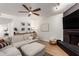 Cozy living room with stylish decor, a black brick fireplace, and a comfortable sectional sofa at 6869 E Flossmoor Ave, Mesa, AZ 85208