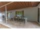 Covered patio featuring dining table and chairs, great for outdoor meals and entertaining in a shaded space at 6869 E Flossmoor Ave, Mesa, AZ 85208