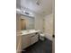Bathroom featuring a vanity, toilet, shower-tub combo and large mirror at 7922 W Alex Ave, Peoria, AZ 85382