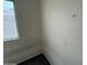 Corner bedroom featuring a window, carpet and unfinished drywall at 7922 W Alex Ave, Peoria, AZ 85382