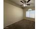 Bedroom with a large window and carpet flooring at 7922 W Alex Ave, Peoria, AZ 85382