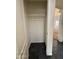 Empty closet in need of repairs has a hanging rod for storage near living area at 7922 W Alex Ave, Peoria, AZ 85382