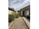 Close up of front entry walkway and garden at 7922 W Alex Ave, Peoria, AZ 85382