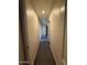 Neutral hallway illuminated by a recessed light at 7922 W Alex Ave, Peoria, AZ 85382