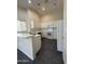 Bright kitchen with white cabinets and appliances at 7922 W Alex Ave, Peoria, AZ 85382