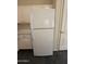 White refrigerator against the wall next to white cabinets at 7922 W Alex Ave, Peoria, AZ 85382