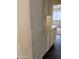 Kitchen cabinets next to textured wall and dark tile flooring at 7922 W Alex Ave, Peoria, AZ 85382