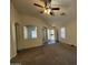 Cozy living room with carpet flooring and a ceiling fan at 7922 W Alex Ave, Peoria, AZ 85382