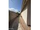 Neutral side yard with a walking path at 7922 W Alex Ave, Peoria, AZ 85382