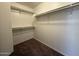 Spacious walk-in closet features shelving and ample storage for an organized wardrobe at 7922 W Alex Ave, Peoria, AZ 85382