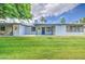Expansive backyard featuring lush green grass and a covered patio at 7950 E Keats Ave # 175, Mesa, AZ 85209