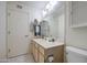Bathroom featuring a sink with a large mirror, cabinets, and a shower-tub combination at 7950 E Keats Ave # 175, Mesa, AZ 85209