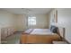 Well-lit bedroom featuring carpet, a ceiling fan, and a large bed with an exterior view through the window at 7950 E Keats Ave # 175, Mesa, AZ 85209