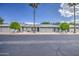 Street view of well-maintained homes featuring lush landscaping, garages, and inviting entrances at 7950 E Keats Ave # 175, Mesa, AZ 85209