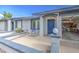 Inviting front porch with seating area leading to the home's entrance and garage at 7950 E Keats Ave # 175, Mesa, AZ 85209