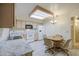 Traditional eat-in kitchen with tile floor, white appliances and laminate countertops at 7950 E Keats Ave # 175, Mesa, AZ 85209