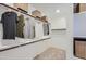 Spacious walk-in closet with multiple shelves, rods, and storage baskets at 8154 E Petra Ave, Mesa, AZ 85212