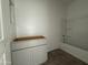 Bright bathroom features a new white vanity and a shower-tub combo at 9536 W Parkway Dr, Tolleson, AZ 85353