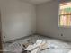 Unfinished bedroom with drywall and a window awaiting final touches at 9536 W Parkway Dr, Tolleson, AZ 85353