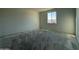 This bedroom boasts a window and ample space at 9536 W Parkway Dr, Tolleson, AZ 85353