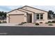 Charming single-story home showcasing desert landscaping and an attached two-car garage at 9536 W Parkway Dr, Tolleson, AZ 85353