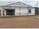 Exterior view of a home under construction with scaffolding and exterior insulation at 9536 W Parkway Dr, Tolleson, AZ 85353