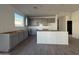 Gray kitchen cabinets offer ample storage in this well-lit space at 9536 W Parkway Dr, Tolleson, AZ 85353