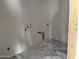 Unfinished laundry room with drywall and plumbing fixtures at 9536 W Parkway Dr, Tolleson, AZ 85353