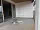 This home has a covered patio with sliding glass doors leading to the interior of the home at 9536 W Parkway Dr, Tolleson, AZ 85353