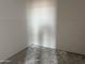Unfinished corner room with white drywall and concrete floors at 9536 W Parkway Dr, Tolleson, AZ 85353