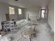 Unfinished room with drywall, large windows and new construction materials at 9536 W Parkway Dr, Tolleson, AZ 85353