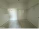 Empty walk-in closet boasts white shelving at 9536 W Parkway Dr, Tolleson, AZ 85353
