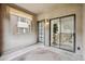 Private balcony features exterior shades and a sliding glass door entrance to interior living space at 9600 N 96 Th St # 130, Scottsdale, AZ 85258
