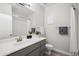 A well-lit bathroom featuring a neutral palette, a large mirror, and a shower-tub combo at 9600 N 96 Th St # 130, Scottsdale, AZ 85258