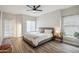 Serene main bedroom with natural light, neutral tones, and a comfortable seating nook by the window at 9600 N 96 Th St # 130, Scottsdale, AZ 85258
