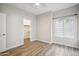 Neutral bedroom with lots of natural light and wood-look floors with a walk-in closet at 9600 N 96 Th St # 130, Scottsdale, AZ 85258