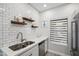 Well-lit kitchen with stainless sink, modern appliances, white countertops, and ample storage options at 9600 N 96 Th St # 130, Scottsdale, AZ 85258