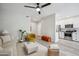 Open-concept living space featuring modern decor and seamless flow into kitchen area with stainless appliances at 9600 N 96 Th St # 130, Scottsdale, AZ 85258