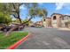 Abundant parking available in this well-maintained community with lush landscaping and blue skies at 9600 N 96 Th St # 130, Scottsdale, AZ 85258