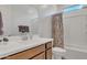 Clean bathroom with a white vanity, a framed mirror, and a shower/tub combo with a patterned shower curtain at 9630 W Atlantis Way, Tolleson, AZ 85353