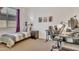 This bedroom features neutral carpet, a twin bed, workspace and a large window for natural light at 9630 W Atlantis Way, Tolleson, AZ 85353