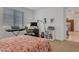 Bright bedroom with a music keyboard, desk, and a view of another room at 9630 W Atlantis Way, Tolleson, AZ 85353