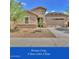 Charming single-story home features a two-car garage and a low-maintenance desert landscape at 9630 W Atlantis Way, Tolleson, AZ 85353